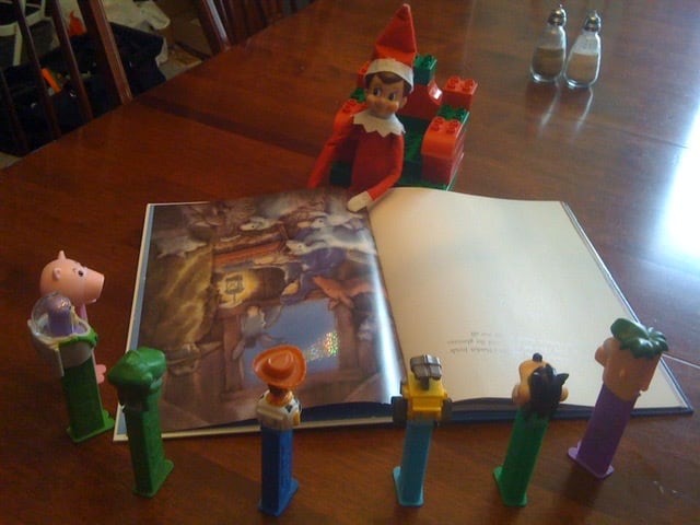 Elf on the Shelf reading Pez Dispensers the Christmas Story