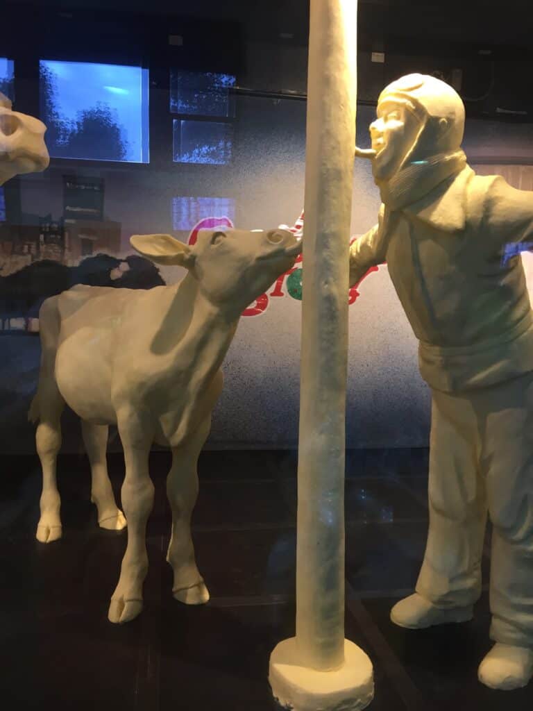 Butter calf and Schwartz with tongue stuck to the flagpole from A Christmas Story