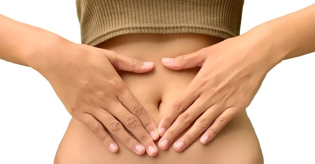 Woman with hands on her belly