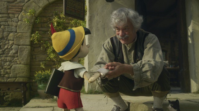 Geppetto played by Tom Hanks talking with Pinocchio