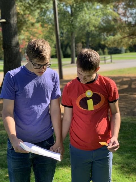 Two boys doing a nature hike science unit study