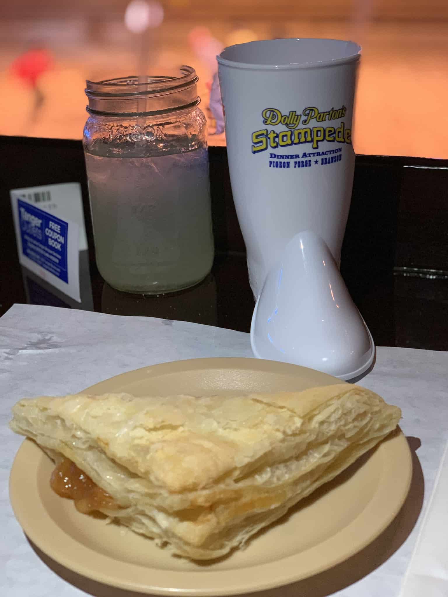 Apple Turnover, Boot-shaped Mug and drink at Dolly Parton's Stampede Dinner Attraction