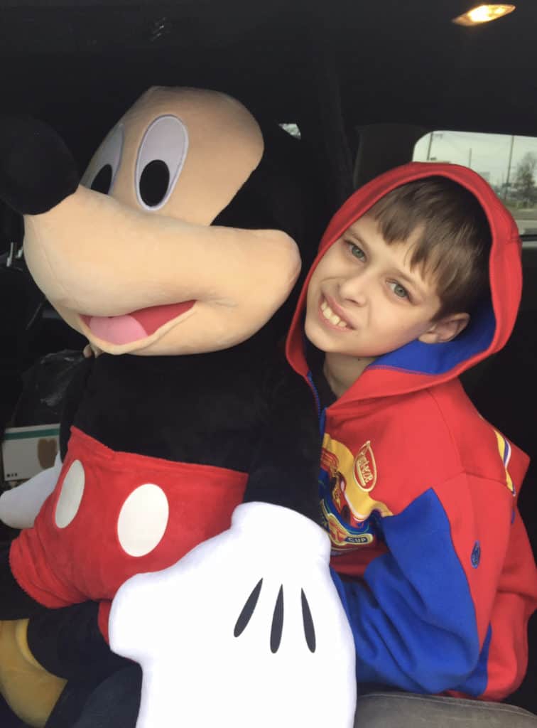 Boy and Giant Stuffed Mickey Mouse