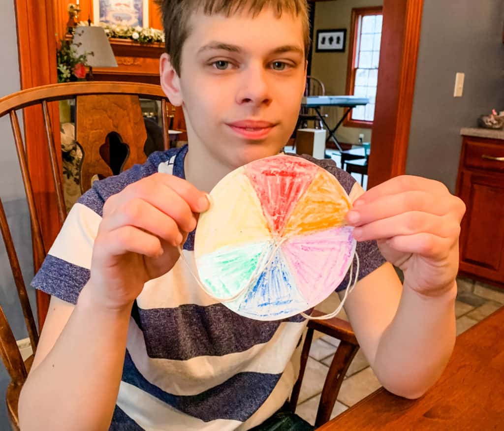 Teaching with Rainbows Boy holding color wheel