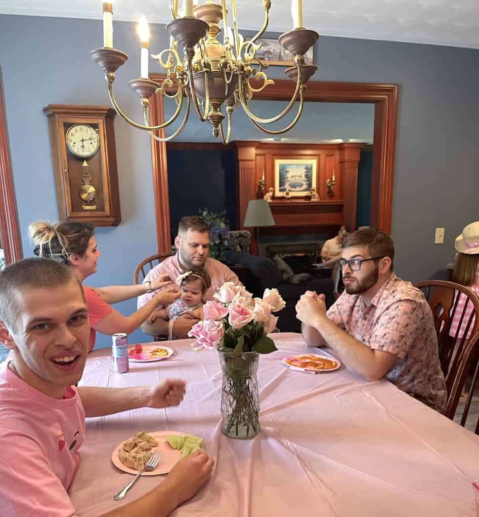 Photo of a party where everyone is wearing pink.