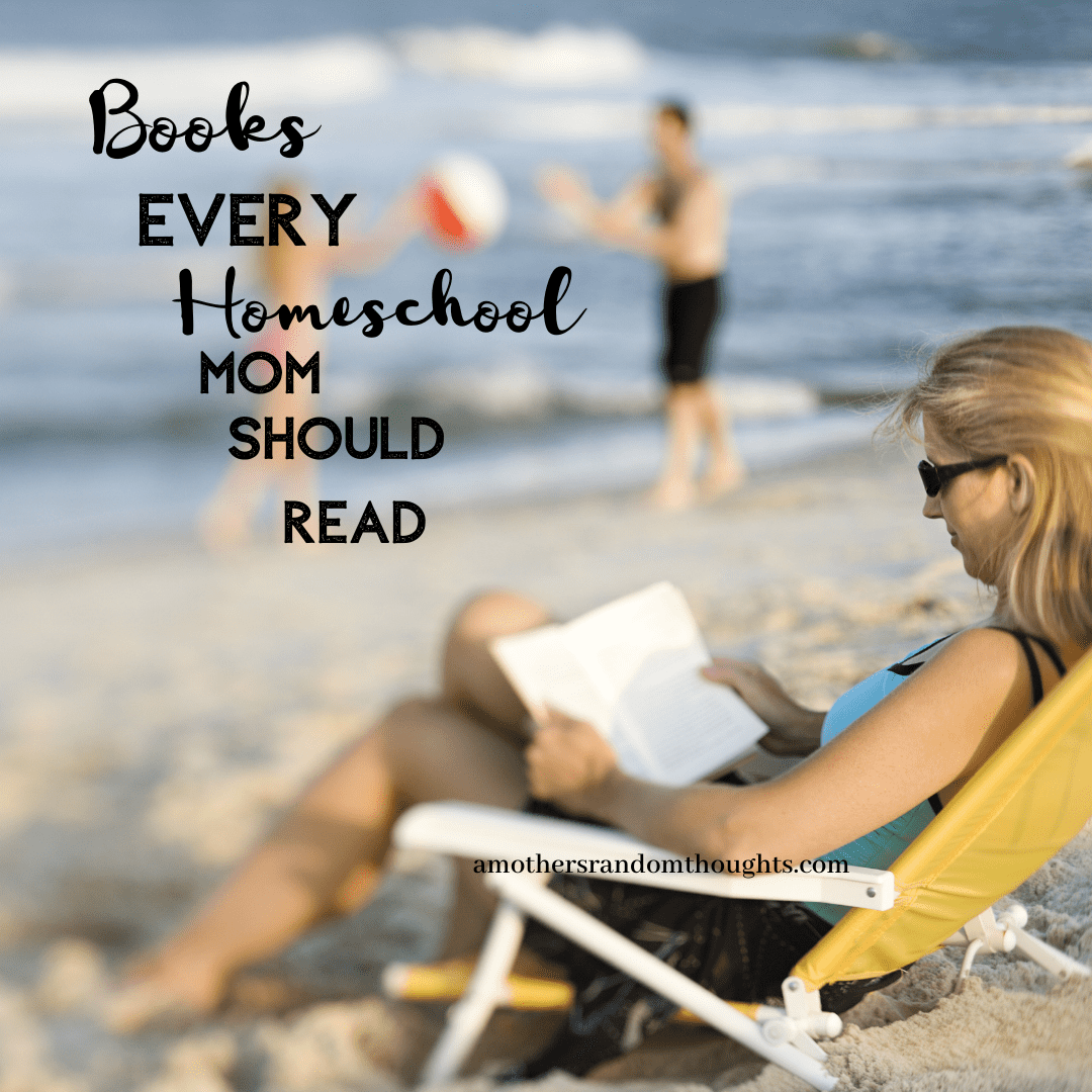 Woman reading a book sitting on the beach