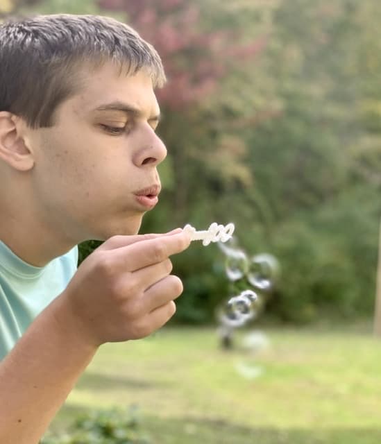 boy blowing bubbles science unit study