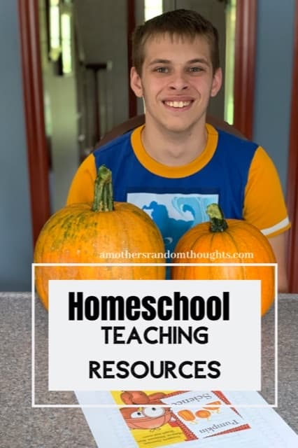 Homeschool printable teaching Resources Boy smiling with 2 pumpkins