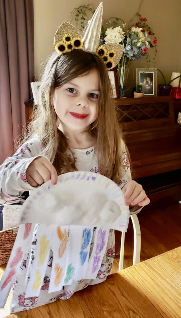 Art project with clouds and rainbow