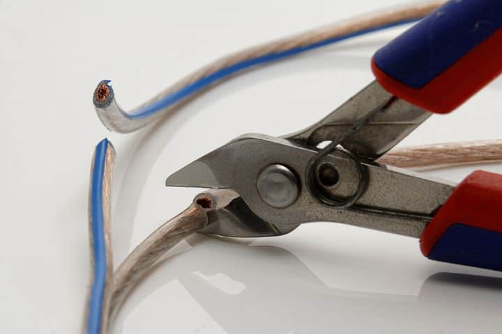 cutting a cable with wire cutters