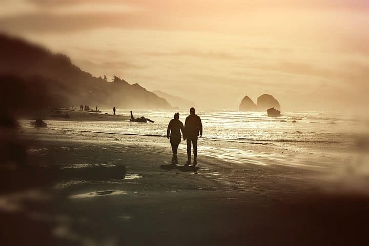 Couple walking on the beach the life I took for granted