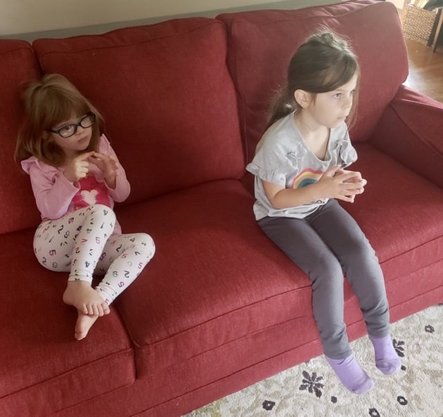 two girls doing fingerplay for musik at home homeschool review