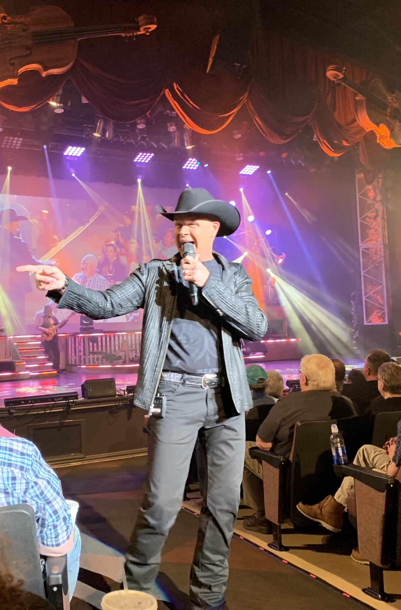 Clay Cooper strolls through the audience at the Cooper Theater