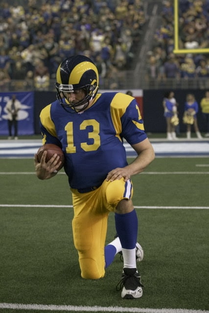 Kurt Warner played by Zachary Levi on the football field