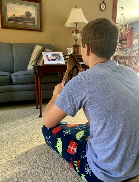 boy watching musik at home video