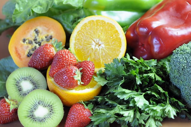 Fruits and vegetables - strawberries, kiwi, lemon, parsley, broccoli, peppers, lettuce