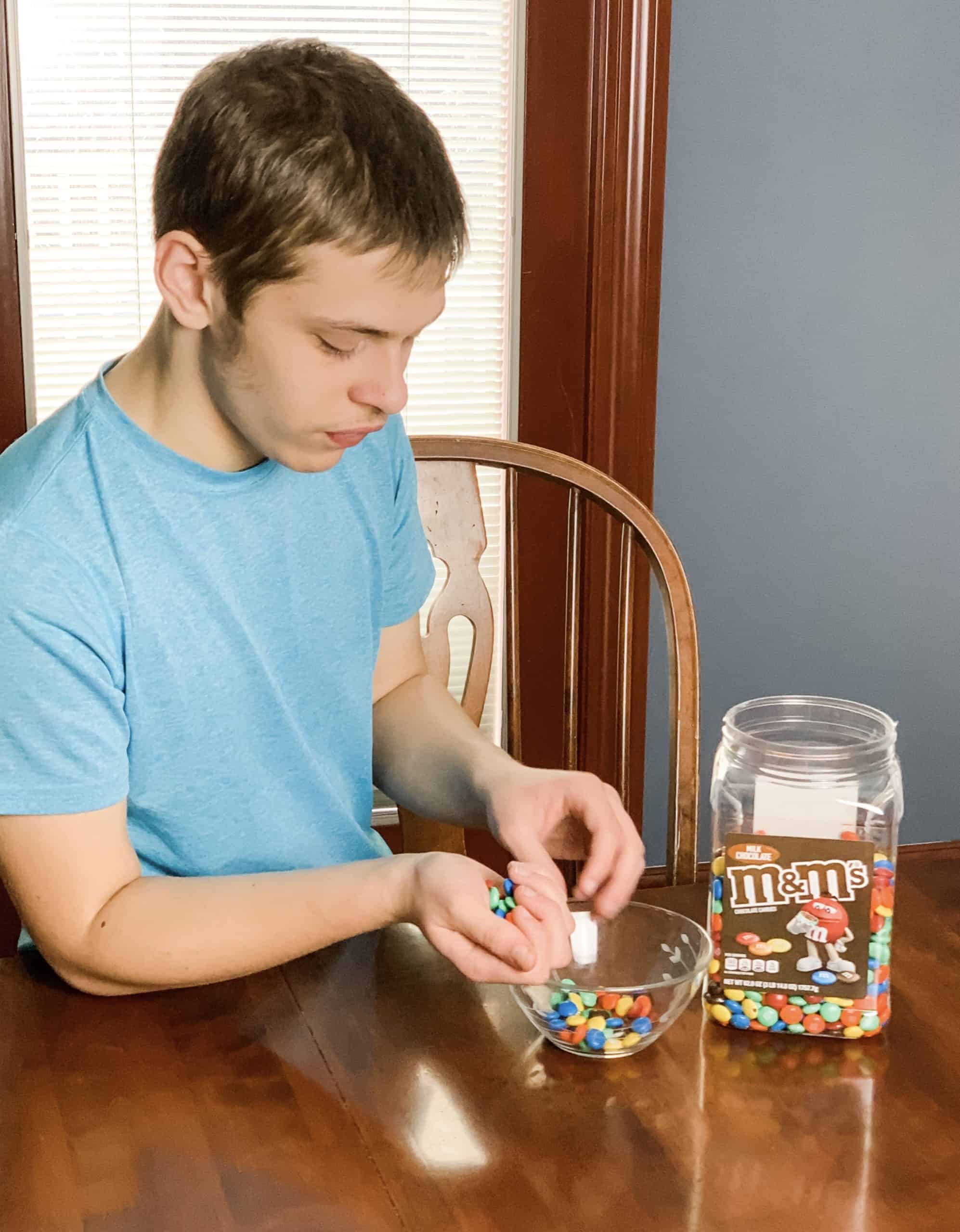 boy counting m&m's