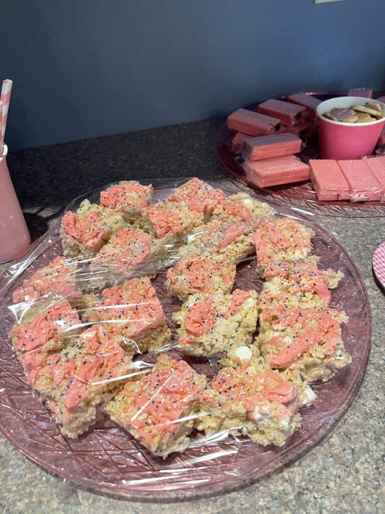 Rice Krispy treats with pink chocolate and strawberry wafer cookies
