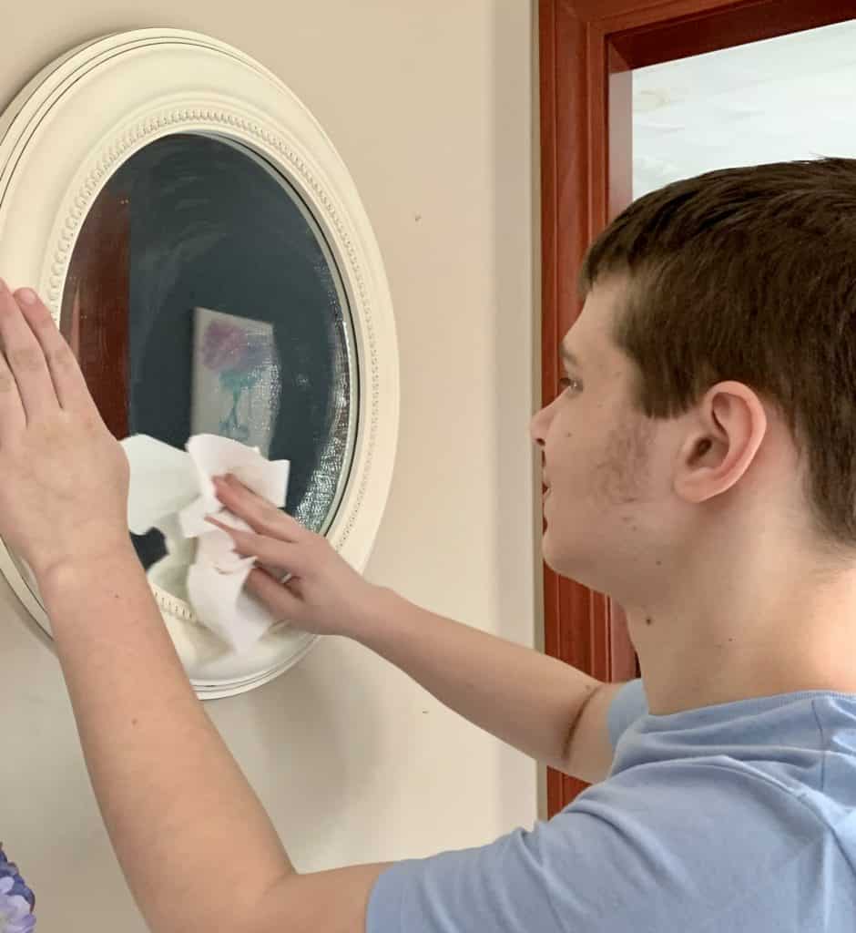 Boy cleaning mirror - cleaning for kids