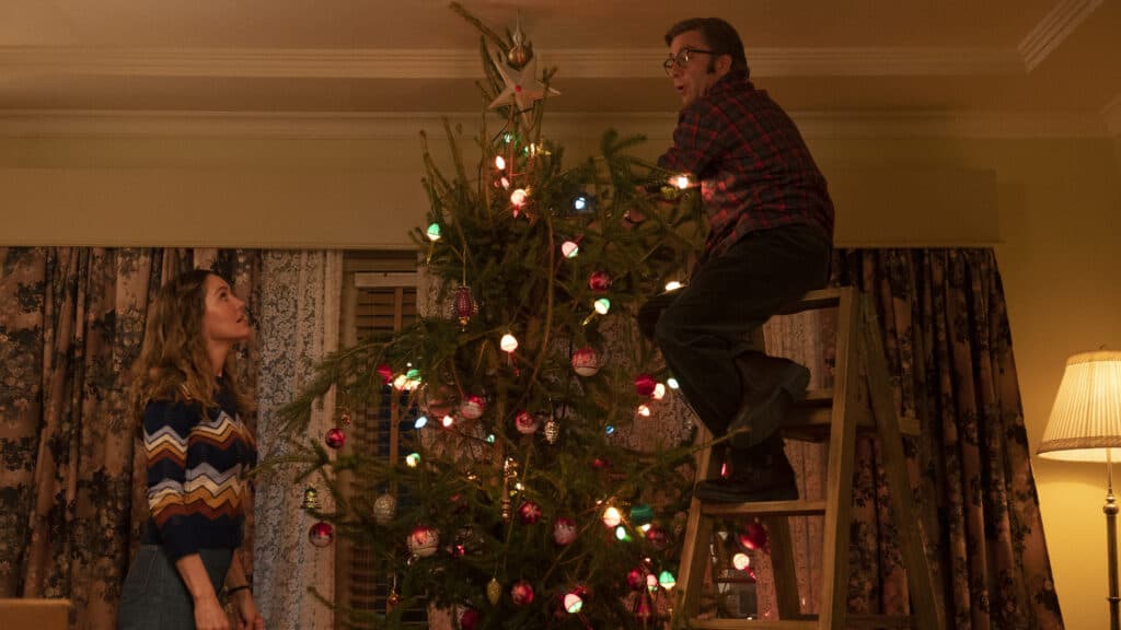 Ralph, now an adult, attempts to decorate a Christmas tree in A Christmas Story Christmas. A sequel to A Christmas Story