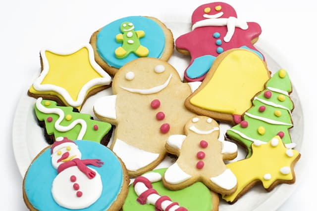 Cut out Christmas cookies, tree bell, snowman, candy cane