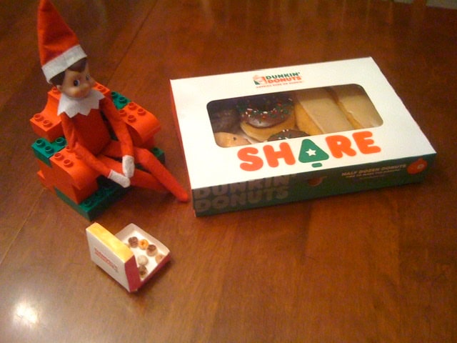 Elf on the Shelf sharing donuts