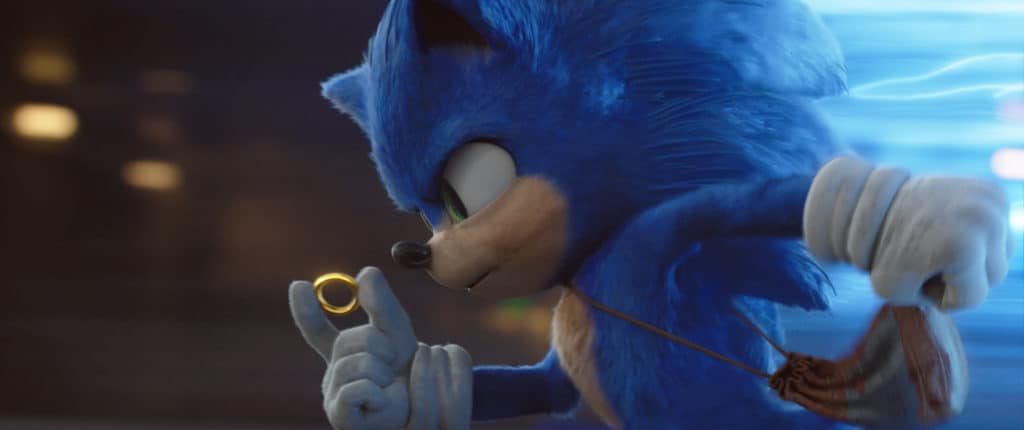 Sonic the hedgehog holding a gold ring