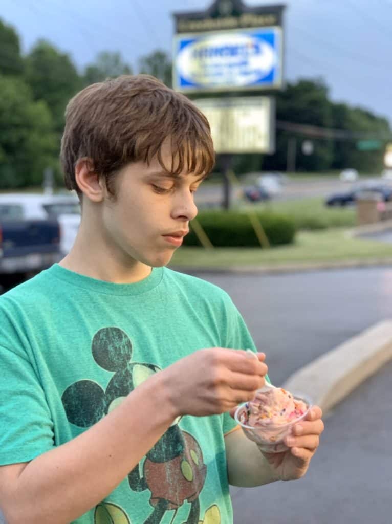 Autistic boy eating ice cream