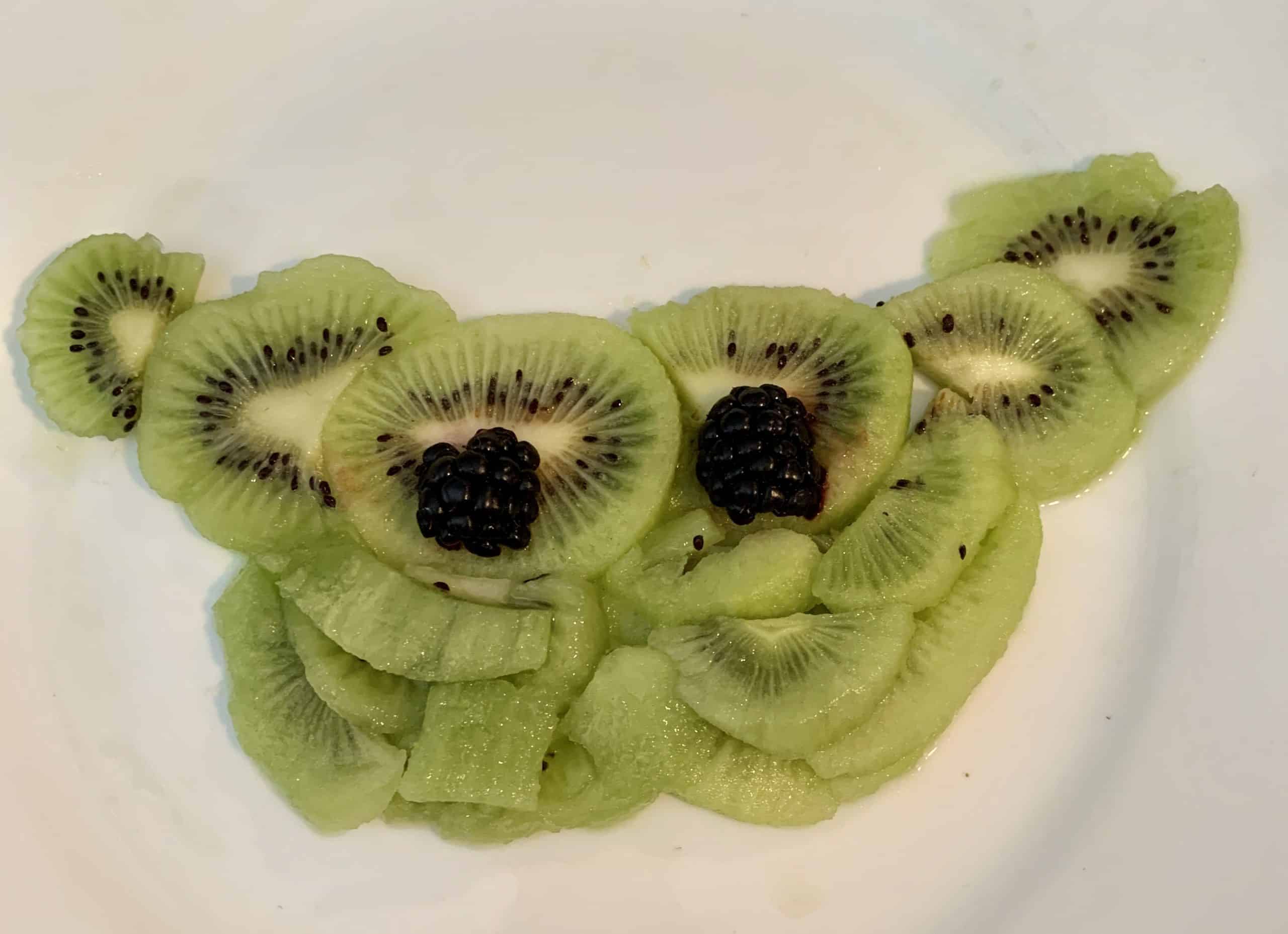 kiwi and blackberries make a baby yoda face