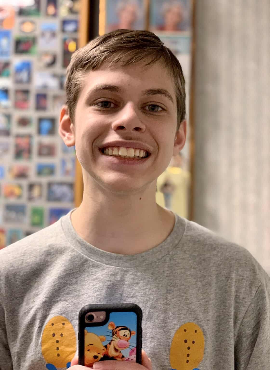 Boy smiling after a dentist visit autism