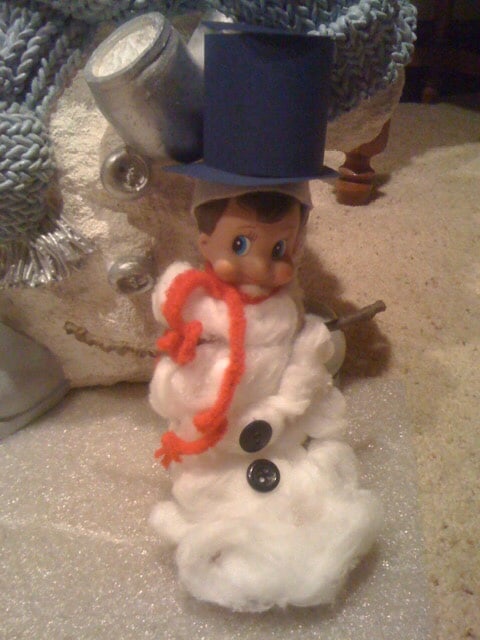 Elf pretending to be a snowman