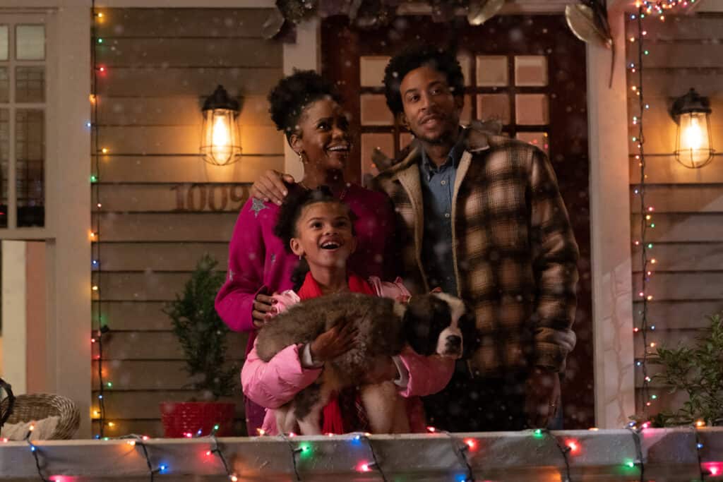 Eddie, Charlotte, and Allison Garrick, a black family in the Disney+ movie Dashing through the Snow.