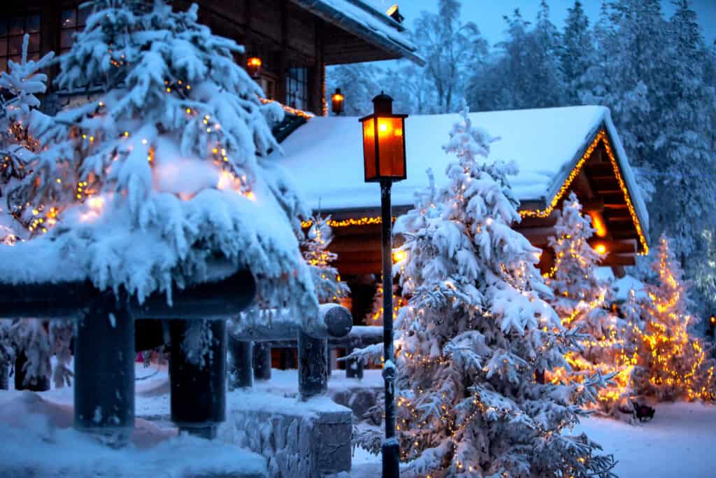 Christmas cottage with snow and decorated for Christmas
