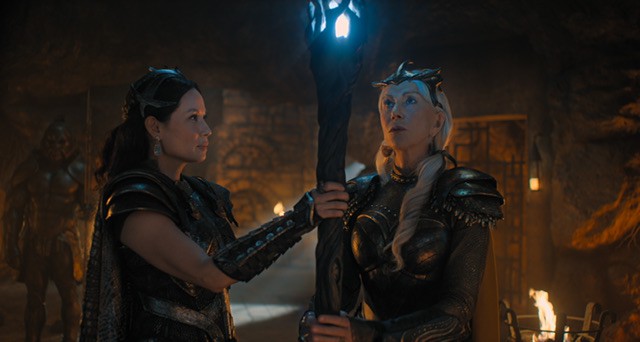 Shazam 2 starring Lucy Liu and Helen Mirren. Two women holding wooden glowing staff.