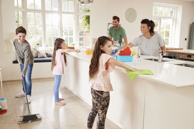 family cleaning kitchen