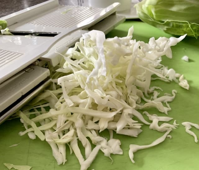 Making sauerkraut - shredded cabbage