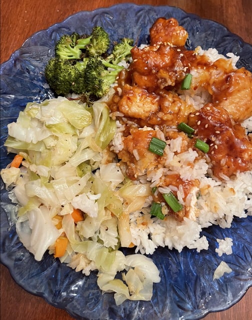 Gluten-Free orange chicken and white rice with sides of roasted broccoli and fried cabbage with carrots