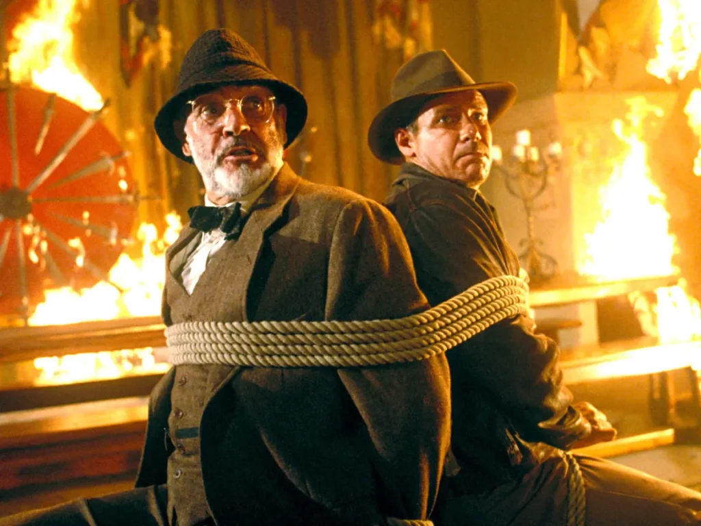 Indiana Jones and the Last Crusade. Harrison Ford and Sean Connery tied together in a burning house.