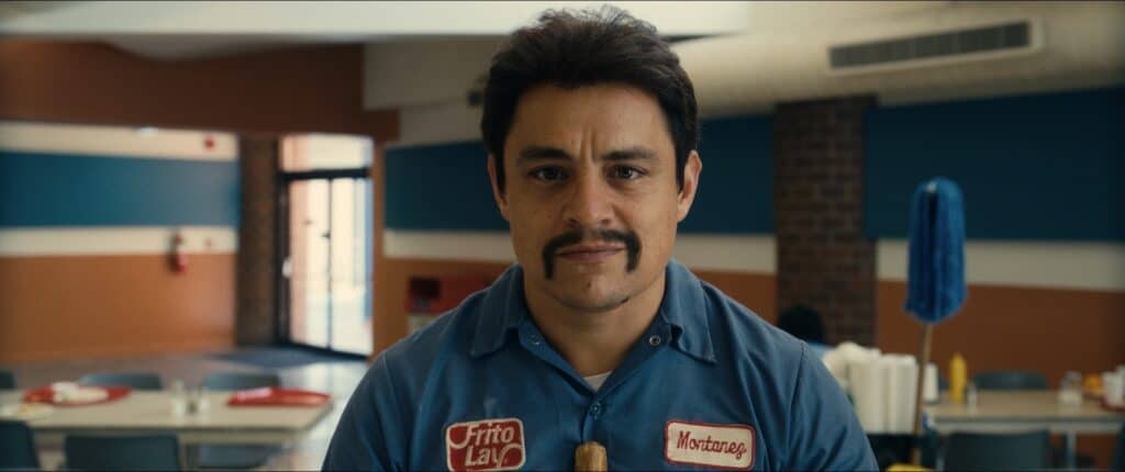 A Mexican-American man with dark hair and a moustache wearing a Frito-Lay uniform.