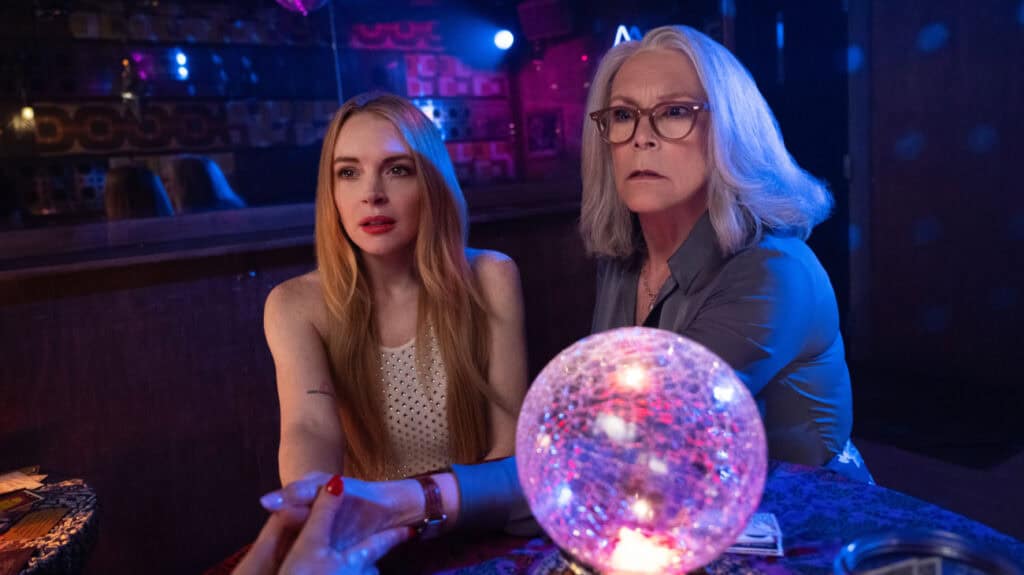 Jamie Lee Curtis and Lindsay Lohan in Freakier Friday getting their palms read