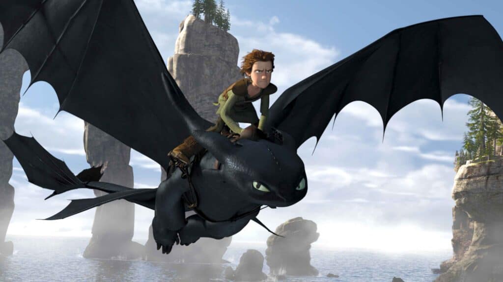 Hiccup riding Toothless in the original 2010 animated How to Train Your Dragon